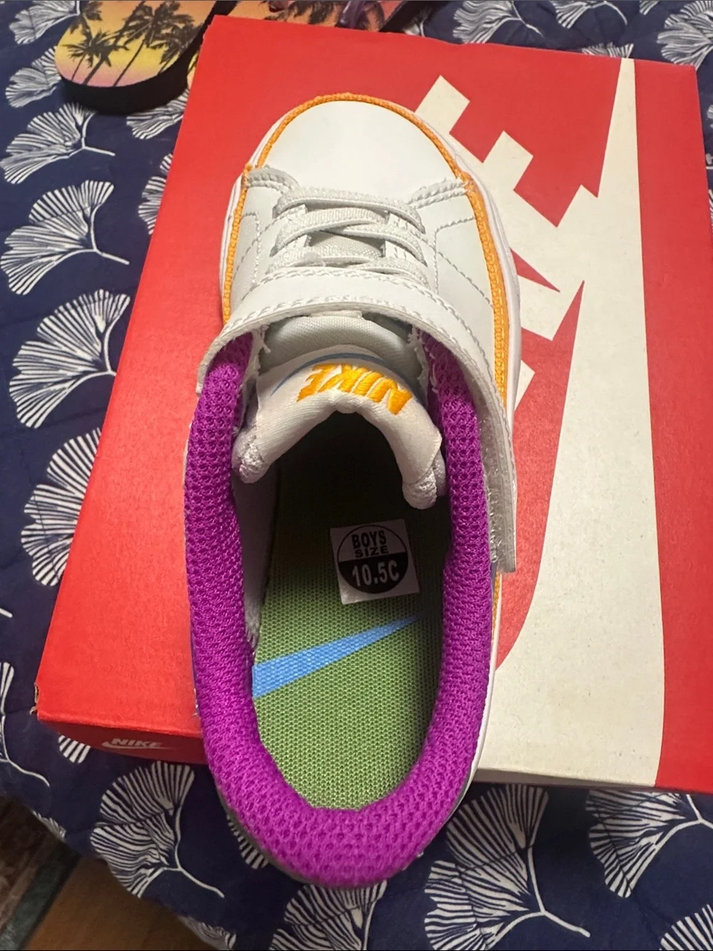 Nike Kids White Sneaker with Blue Swoosh and Purple Lining